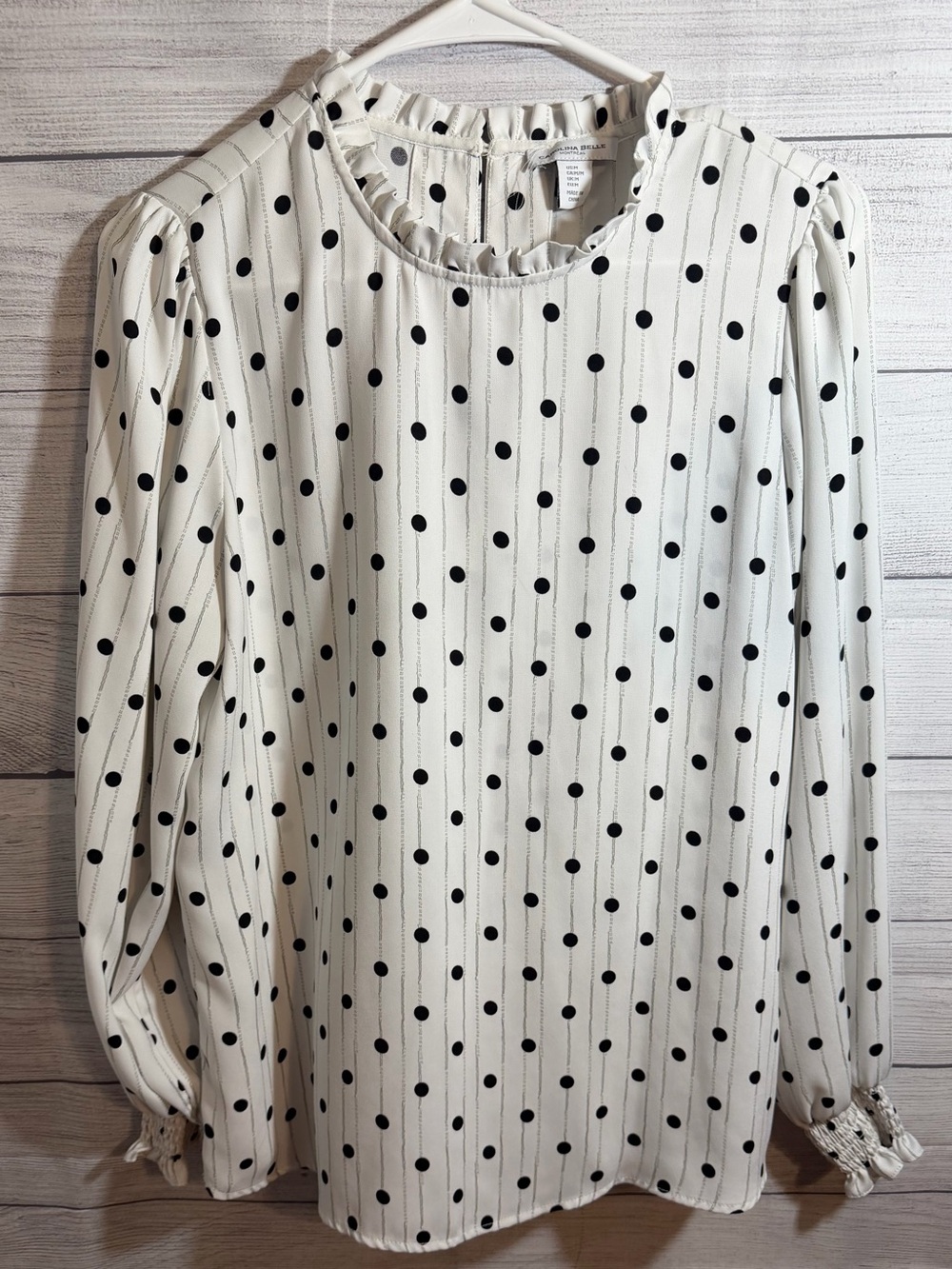 Carolina Belle Black Polka Dot Ruffle Neck Blouse on Cream